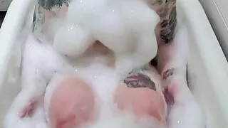 Plump Slut Rubs Pussy In Bathtub