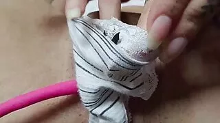 naked woman uses vibrator on her pussy