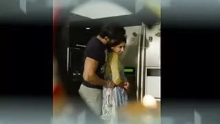 Couple romance in kitchen