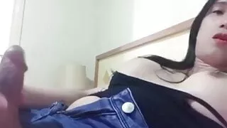 Asian ladyboy enjoys playing her 7 inch cut cock in her bed