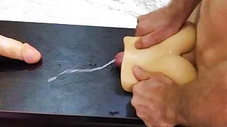 Double penetration in a silicone ass