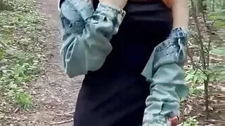 Sexy redheaded pussy walks through the woods almost naked