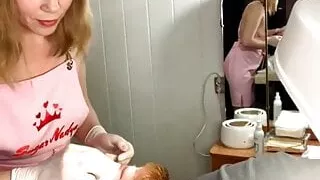 Classy blonde waxes a man's face, her gorgeous breasts popping
