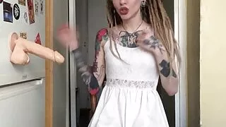 Cute tattooed teen enjoys a sex toy