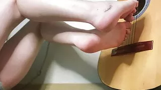 Babe Girl Plays the Guitar with her Perfect Feet