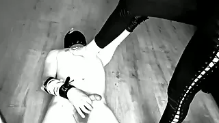 Slave jerks off dick under the supervision of two mistress