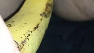 Indian girl playing with banana