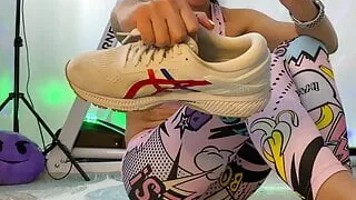 Mistress flexing her muscles and foot fetish with white sneakers