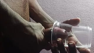 Rajesh masturbating, spitting on cock & cumming in glass 1