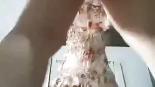 Showing off in front of the mirror, wearing a dress