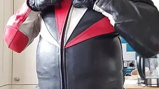 Wanking in biker leathers and helmet