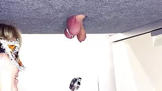 Mistress ties heavy objects to balls on the milking table