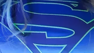 Estebel as Supergirl, stroking and ejaculating.