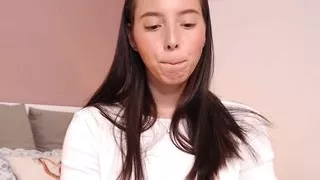 Girl with a beautiful face pulls down her panties and shows her pussy