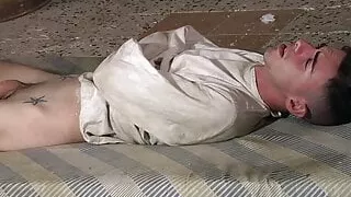 Restrained twink Jesse Evans cock stroked by Xavier Sibley