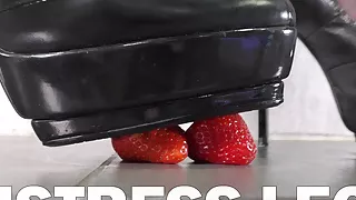 Mistress crushes juicy food with high heels and pantyhose