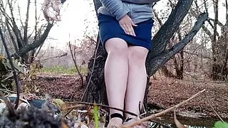 Peeing outdoors legs spread wide