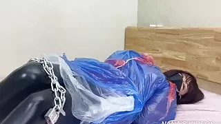 Latex-clad girls in plastic rain wear have chain orgasms