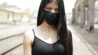 Petite Venezuelan model is approached by Peruvian near train