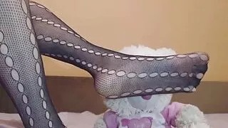 Sexy feet playing with teddy