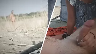My wife jerks my dick in front of a stranger in nudist beach