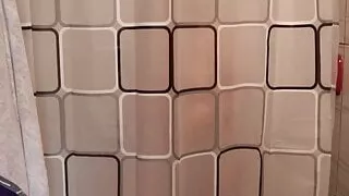 Horny girl danced while she undressed behind the shower curtain