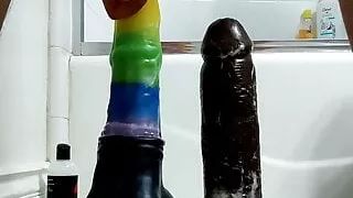 Taking two huge dildos clip