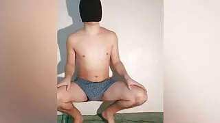 The guy shows how the chastity belt looks in boxer shorts