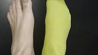 green stockings on one foot and the other barefoot