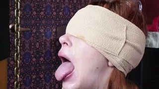 Blindfolded cum addicted redhead slave girl gagging on a cock
