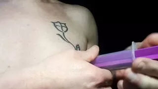 syringe suction of her nipple and piercing