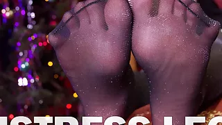 Mistress’ Feet In Slippers And Lurex Pantyhose On New Year's