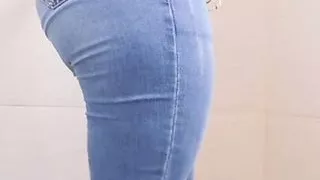 Making a striptease show in the bathroom of the gym