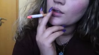 Close-up Cigar Smoke By A Sexy Blonde Woman