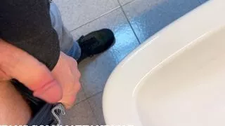 Ginger jerks off in the bathroom at work