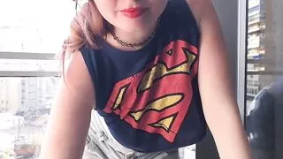 Supergirl Clothed flashing boobs in balcony