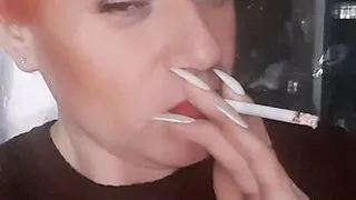 transvestite Sonyastar smokes, long nails, red hair
