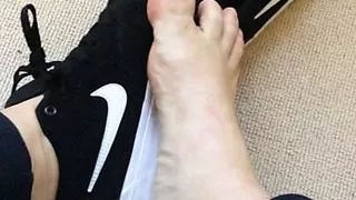 Bare foot taken out of trainers