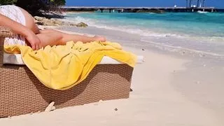 Girl relaxing on a beach – Hot ass – no panties