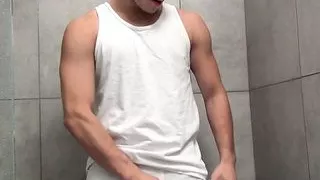 Kinky cute jock Jimmy Roman pees on himself and jerks off