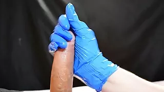 Handjob with nitrile gloves made him cum like a fountain,thick yellowish cum loads.