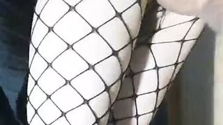 Slender girlfriend in a skirt and stockings fucked while standing in her tight pussy with creampie