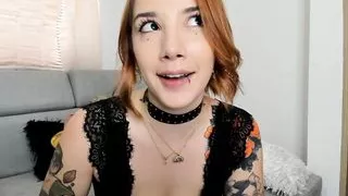 Sexy redheaded Colombian with a tattooed body, big natural tits and a very wet pussy