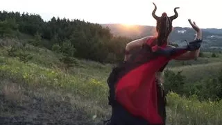 Maleficent on sunset sky