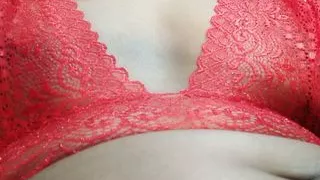 Two boobs in a red net bra