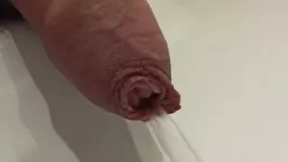 Pissing in a public toilet sink