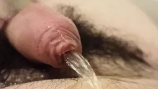 Close-up peeing on my belly