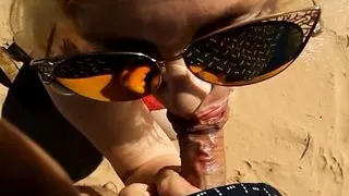 Blowjob from a mature mom on the beach