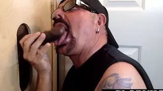 Gloryhole mature sucking off two guys in interracial trio