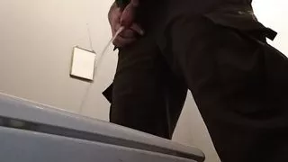 Long stream of pee in a public toilet